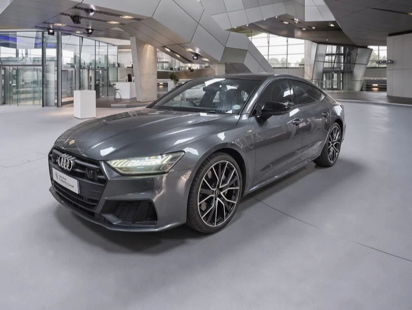 Same grey Audi in a modern architectural showroom